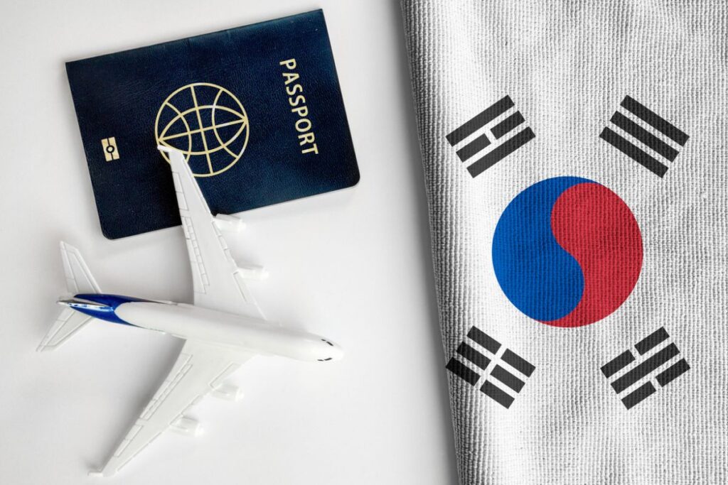 Flag-of-South-Korea-with-passport-and-toy-airplane