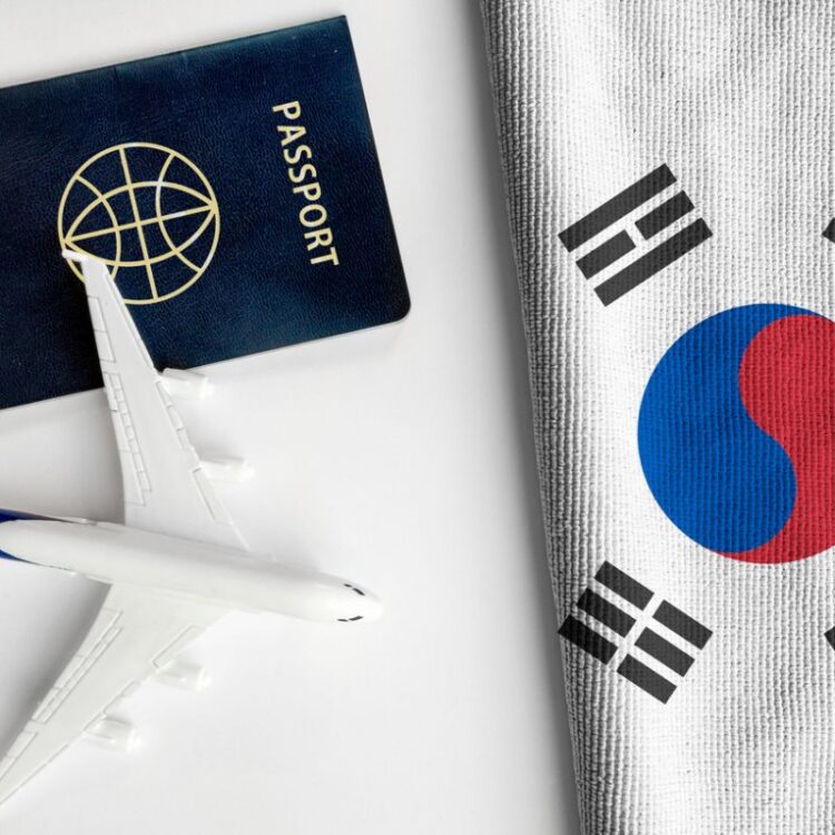 Flag-of-South-Korea-with-passport-and-toy-airplane